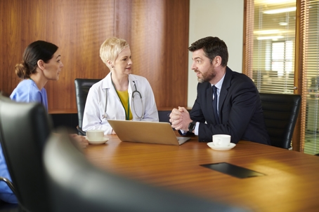 Senior doctor with lawyer